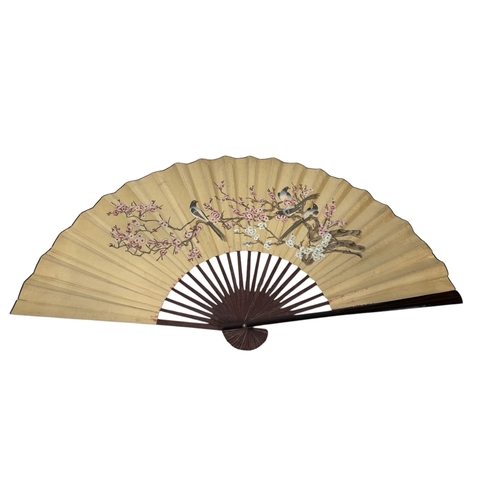 289 - A LARGE CHINESE PAINTED FAN
180 x 100 cm