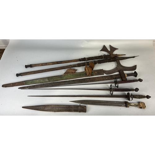 306 - A COLLECTION OF ANTIQUE MILITARIA TO INCLUDE DAGGERS, SWORDS, AXES AND FOILS
One dagger possibly Per... 