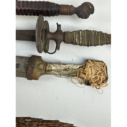 306 - A COLLECTION OF ANTIQUE MILITARIA TO INCLUDE DAGGERS, SWORDS, AXES AND FOILS
One dagger possibly Per... 