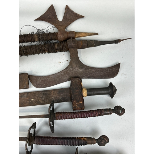 306 - A COLLECTION OF ANTIQUE MILITARIA TO INCLUDE DAGGERS, SWORDS, AXES AND FOILS
One dagger possibly Per... 