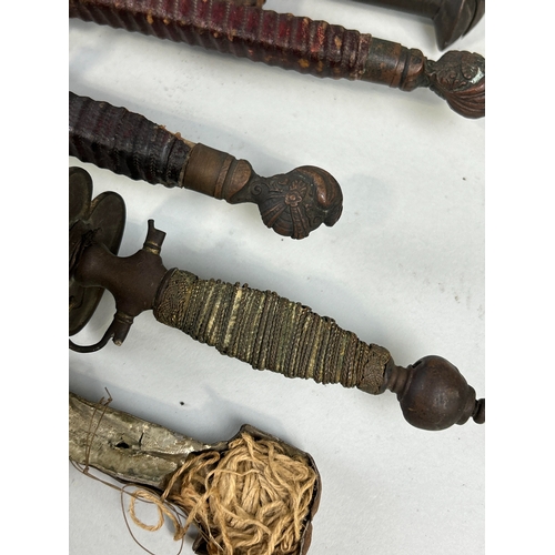 306 - A COLLECTION OF ANTIQUE MILITARIA TO INCLUDE DAGGERS, SWORDS, AXES AND FOILS
One dagger possibly Per... 