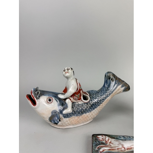 319 - A JAPANESE ARITA STYLE BOY RIDING A CARP ALONG WITH A BLUE GLAZED CERAMIC BOWL, CHINESE BRUSH POT AN... 