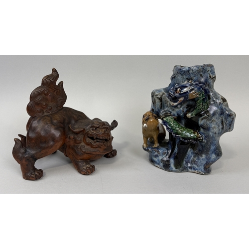 321 - A TERRACOTTA TEMPLE LION ALONG WITH A STONEWARE VASE WITH A DRAGON
Tallest 21cm H
 ... 