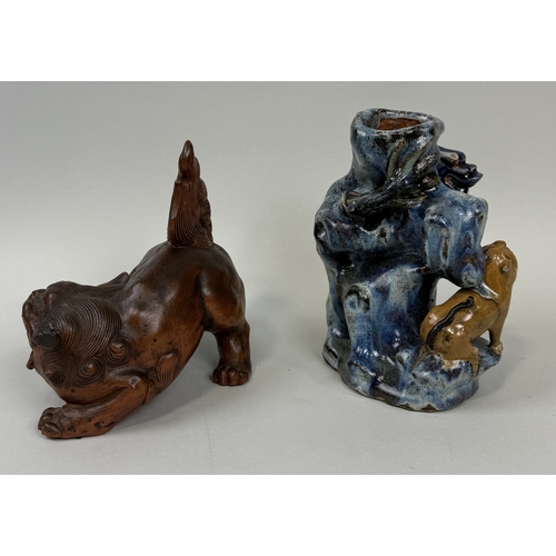 321 - A TERRACOTTA TEMPLE LION ALONG WITH A STONEWARE VASE WITH A DRAGON
Tallest 21cm H
 ... 