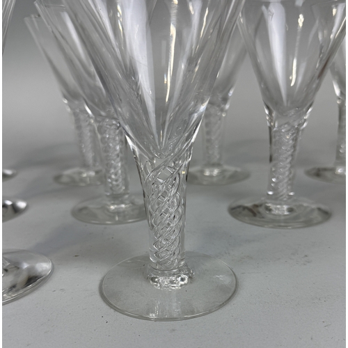 366 - A SET OF NINE TWISTED STEM GLASSES ALONG WITH THREE CANDLESTICKS