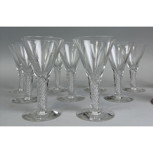 366 - A SET OF NINE TWISTED STEM GLASSES ALONG WITH THREE CANDLESTICKS