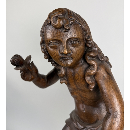 6 - A 17TH CENTURY OR EARLIER CARVED WOODEN FIGURE OF CUPID
51cm H
With stand 71cm H
Provenance: Private... 