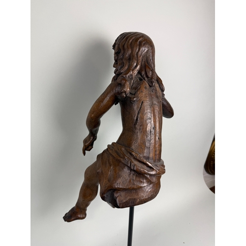 6 - A 17TH CENTURY OR EARLIER CARVED WOODEN FIGURE OF CUPID
51cm H
With stand 71cm H
Provenance: Private... 