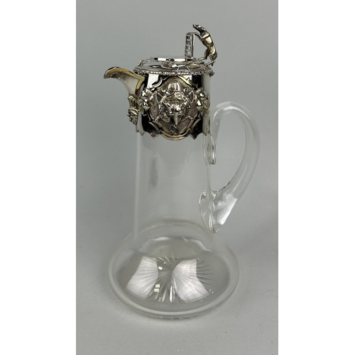 61 - A VICTORIAN SILVER MOUNTED CLARET JUG WITH FOX-HUNTING DESIGN
29cm H