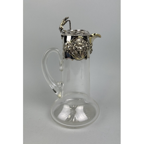 61 - A VICTORIAN SILVER MOUNTED CLARET JUG WITH FOX-HUNTING DESIGN
29cm H