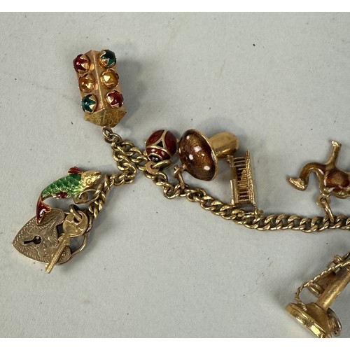 150 - AN 18CT GOLD CHARM BRACELET
The charms ranging from 9ct to 18ct and possibly foreign gold or yellow ... 