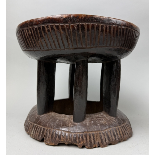 123 - TWO AFRICAN HARDWOOD MILKING STOOLS
Largest 32cm x 25cm