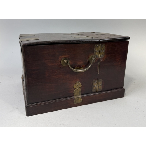 131 - A CHINESE HARD WOOD VANITY CASE WITH MIRROR
When closed 32cm x 24cm x 20cm