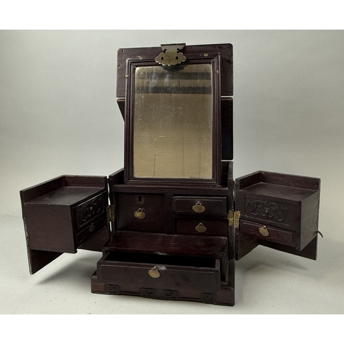 131 - A CHINESE HARD WOOD VANITY CASE WITH MIRROR
When closed 32cm x 24cm x 20cm