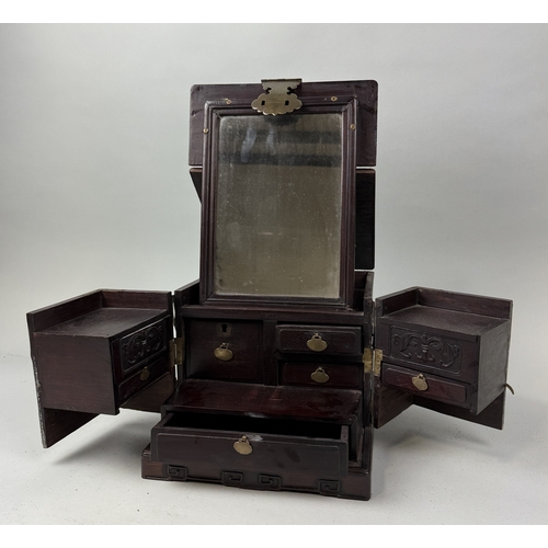 131 - A CHINESE HARD WOOD VANITY CASE WITH MIRROR
When closed 32cm x 24cm x 20cm