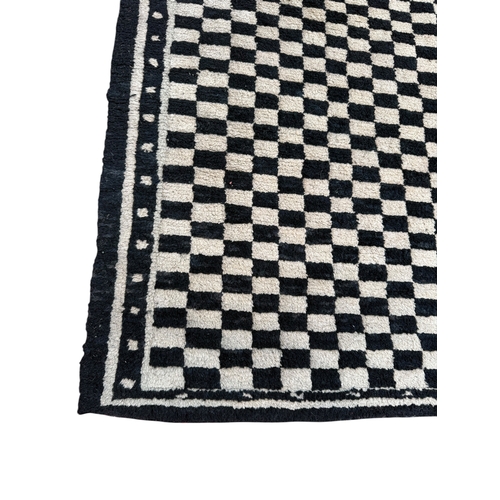 135 - A MOROCCAN CHEQUERED CARPET
175cm x 90cm