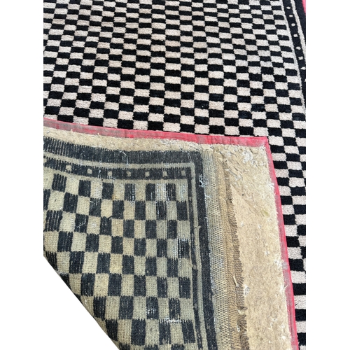 135 - A MOROCCAN CHEQUERED CARPET
175cm x 90cm