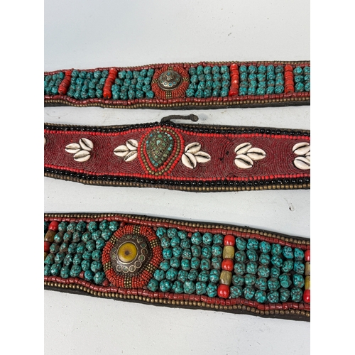 137 - THREE TIBETAN BELTS, SET WITH TURQUOISE AND SHELLS
Largest 66cm L