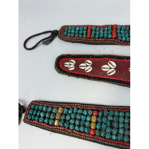 137 - THREE TIBETAN BELTS, SET WITH TURQUOISE AND SHELLS
Largest 66cm L