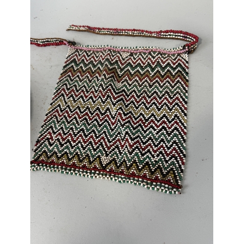 138 - AN AFRICAN BEADED BAG AND A NECKLACE
Bag 20cm x 19cm