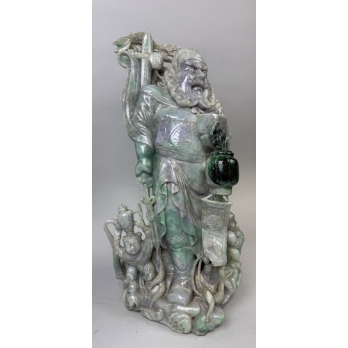 149 - A CHINESE JADE OR JADEITE CARVING POSSIBLY DEPICTING THE GOD OF WEALTH
53cm x 28cm