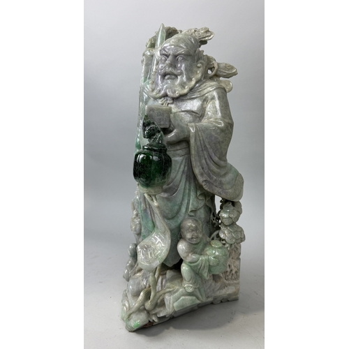 149 - A CHINESE JADE OR JADEITE CARVING POSSIBLY DEPICTING THE GOD OF WEALTH
53cm x 28cm