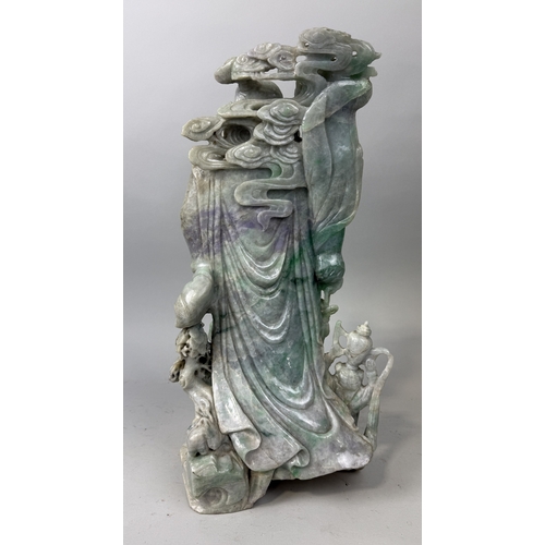 149 - A CHINESE JADE OR JADEITE CARVING POSSIBLY DEPICTING THE GOD OF WEALTH
53cm x 28cm