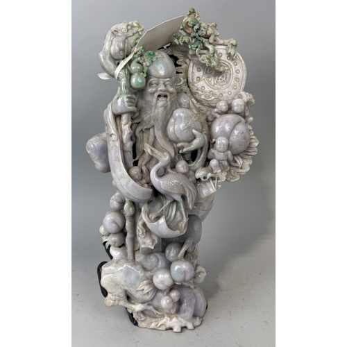 150 - A CHINESE JADE OR JADEITE SCULPTURE DEPICTING A FIGURE WITH BIRD AND FRUIT
52cm x 30cm