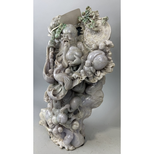 150 - A CHINESE JADE OR JADEITE SCULPTURE DEPICTING A FIGURE WITH BIRD AND FRUIT
52cm x 30cm