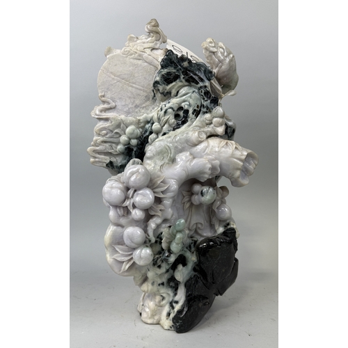 150 - A CHINESE JADE OR JADEITE SCULPTURE DEPICTING A FIGURE WITH BIRD AND FRUIT
52cm x 30cm