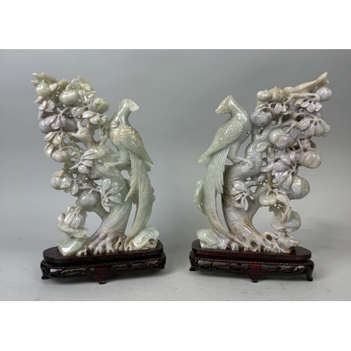 155 - A PAIR OF CHINESE JADE SCULPTURES DEPICTING BIRDS ON BRANCHES WITH FRUIT
Approximately 29cm x 21cm e... 