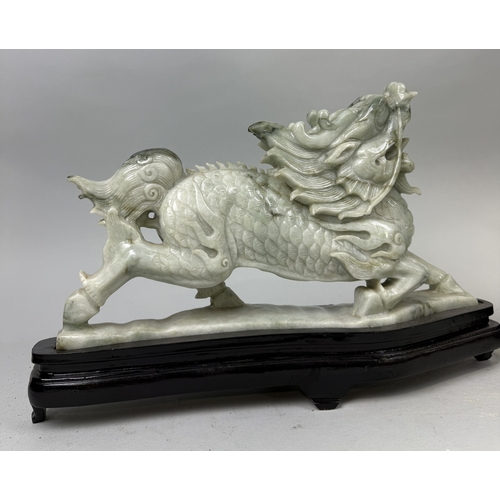 158 - A PAIR OF CHINESE JADE DRAGONS ON STANDS
Dragons 36cm x 20cm each