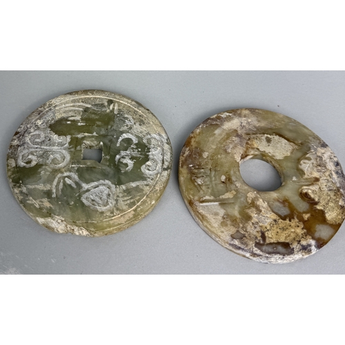 172A - A PAIR OF CHINESE JADE BI DISCS
9cm each.