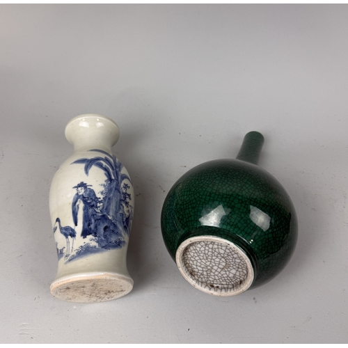 183 - TWO CHINESE VASES, ONE GREEN CRACKLE GLAZED THE OTHER BLUE AND WHITE DECORATED WITH FIGURES
Tallest ... 