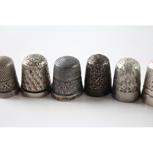 230 - A GROUP OF EIGHT .925 STERLING SILVER THIMBLES INCLUDING ANTIQUE, CHARLES HORNER
Weight: 48gms... 