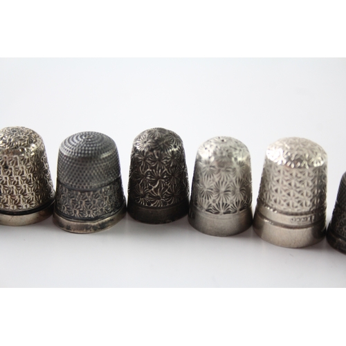 230 - A GROUP OF EIGHT .925 STERLING SILVER THIMBLES INCLUDING ANTIQUE, CHARLES HORNER
Weight: 48gms... 