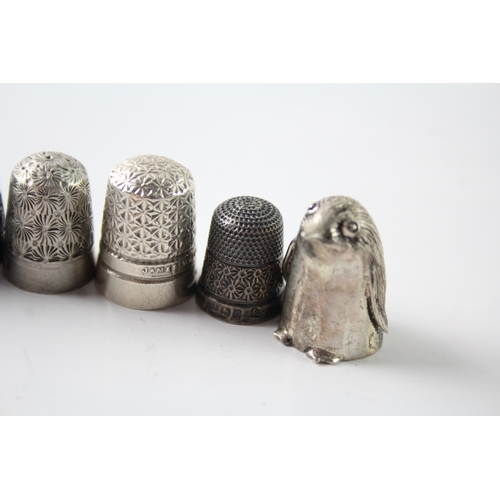 230 - A GROUP OF EIGHT .925 STERLING SILVER THIMBLES INCLUDING ANTIQUE, CHARLES HORNER
Weight: 48gms... 