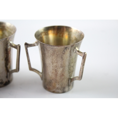 240 - THREE EDWARDIAN .925 STERLING SILVER TRIPLE HANDLED CUPS
Weight: 84gms