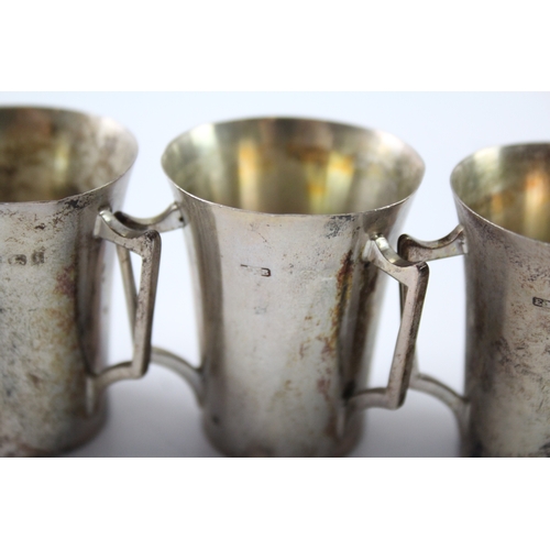 240 - THREE EDWARDIAN .925 STERLING SILVER TRIPLE HANDLED CUPS
Weight: 84gms