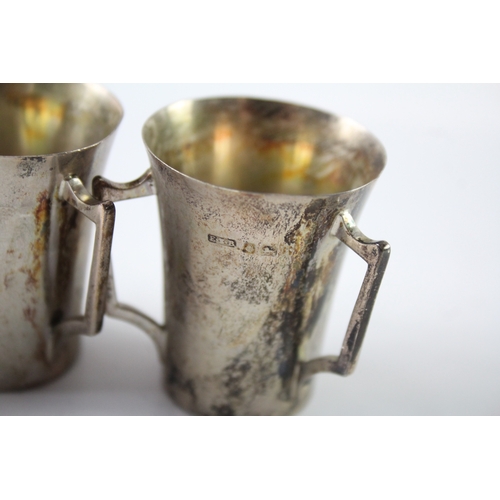 240 - THREE EDWARDIAN .925 STERLING SILVER TRIPLE HANDLED CUPS
Weight: 84gms