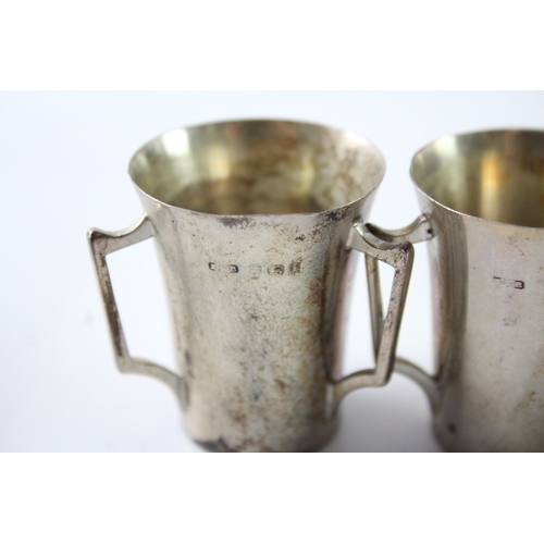 240 - THREE EDWARDIAN .925 STERLING SILVER TRIPLE HANDLED CUPS
Weight: 84gms