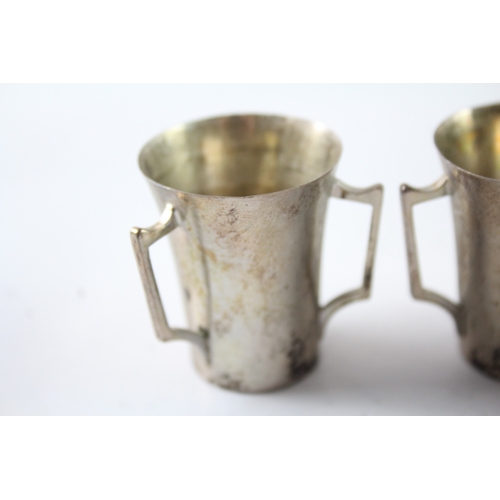 240 - THREE EDWARDIAN .925 STERLING SILVER TRIPLE HANDLED CUPS
Weight: 84gms