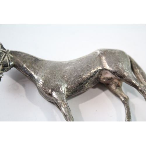 264 - A .925 STERLING SILVER NOVELTY HORSE FIGURE
Weight: 63gms