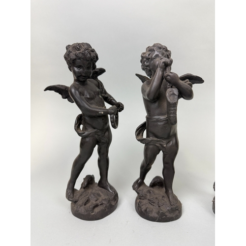 294 - A GROUP OF FOUR BRONZE PUTTI SIGNED 'MOREAU'
30cm H each.