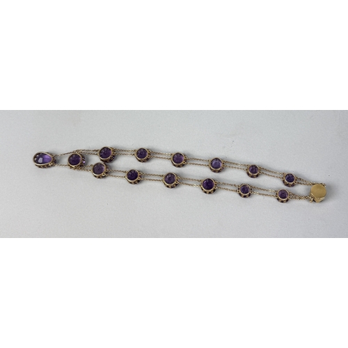 321 - AN ANTIQUE GRADUATED AMETHYST NECKLACE SET IN HIGH CARAT GOLD
Weight: 36.4gms
42cm L... 