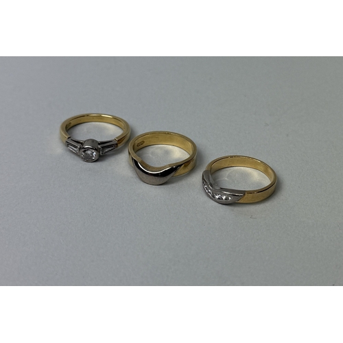 322 - AN 18T GOLD TRILOGY OF RINGS , TWO WITH DIAMONDS
Weight: 11.2gms