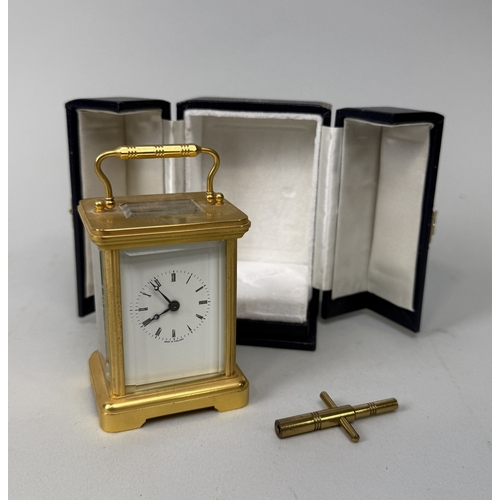 362 - A BRASS CARRIAGE CLOCK PRESENTED AS A DIPLOMATIC GIFT BY QUEEN ELIZABETH II
Housed in a blue leather... 