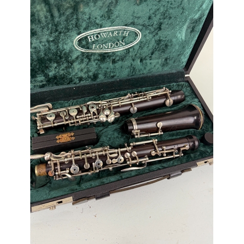 367 - A HOWARTH LONDON BLACK WOOD OBOE
In original case.