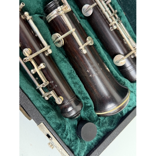 367 - A HOWARTH LONDON BLACK WOOD OBOE
In original case.