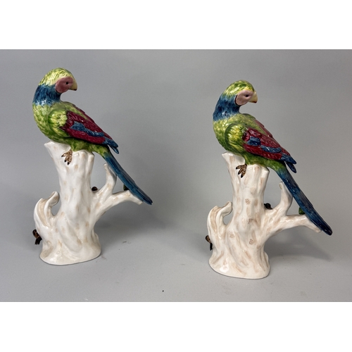 387 - A PAIR OF PAINTED PORCELAIN PARROTS
31cm H